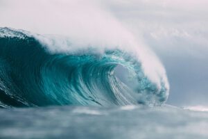 photo of a crashing blue wave